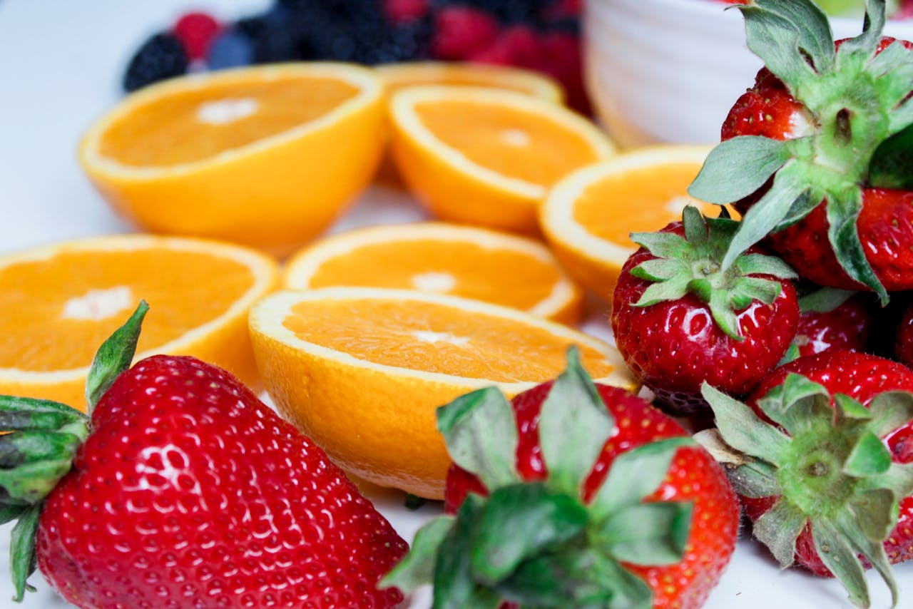 services-01 Close-up of sliced oranges and strawberries, showcasing vibrant colors and fresh appeal.