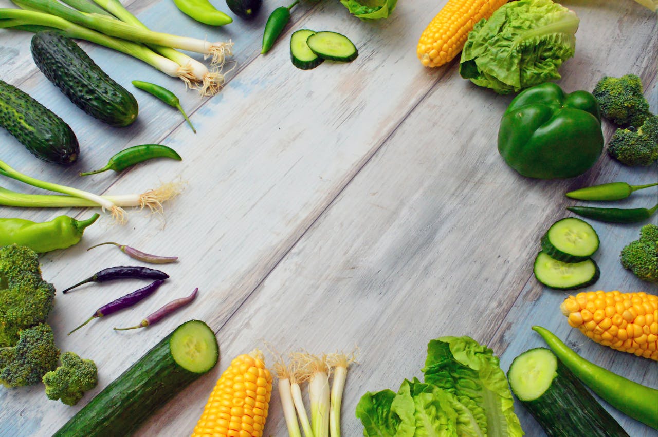 why-choose-us An assortment of fresh vegetables on a wooden table, perfect for healthy cooking.